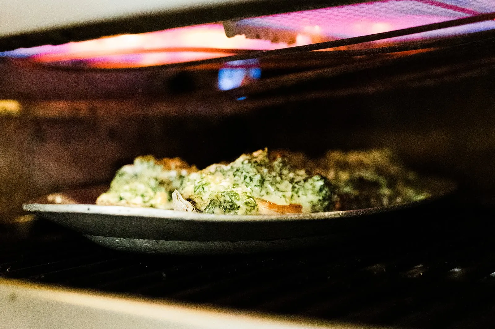 Oysters cooking under the broiler